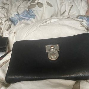 Michael Kors black zip around wallet with silver hardware
